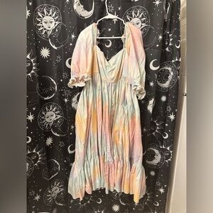 Selkie dopamine midi dress with short puff sleeves and square neckline.